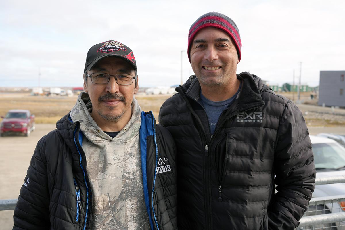 Two men standing together